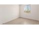 Bright bedroom featuring wood-look tile floors and a window providing natural light at 11619 W Green Dr, Youngtown, AZ 85363