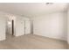 Large bedroom featuring neutral carpeting and a light-filled, airy atmosphere at 11619 W Green Dr, Youngtown, AZ 85363