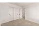 Bedroom with sliding closet doors offers functional storage space at 11619 W Green Dr, Youngtown, AZ 85363