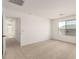 Well-lit bedroom featuring plush carpeting and plenty of natural light at 11619 W Green Dr, Youngtown, AZ 85363