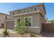 A charming, two-story home featuring neutral tones and a well-manicured desert landscaped yard at 11619 W Green Dr, Youngtown, AZ 85363
