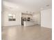 Open living space with tile floors, abundant natural light, and modern fixtures throughout at 11619 W Green Dr, Youngtown, AZ 85363