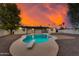 Inviting backyard pool with diving board and a beautiful sunset at 12444 N 33Rd St, Phoenix, AZ 85032