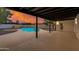Covered backyard patio overlooking a sparkling pool at 12444 N 33Rd St, Phoenix, AZ 85032
