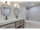 Modern bathroom with double sinks, stylish lighting, hexagon shower tiling, and fixtures at 12444 N 33Rd St, Phoenix, AZ 85032
