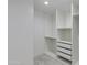Walk-in closet with built-in shelving and drawers, providing ample storage space at 12444 N 33Rd St, Phoenix, AZ 85032
