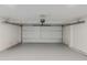 Clean, empty garage with epoxy flooring, and an automated door opener at 12444 N 33Rd St, Phoenix, AZ 85032