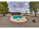 Backyard pool with diving board and surrounding lush landscaping, perfect for summer fun at 12444 N 33Rd St, Phoenix, AZ 85032