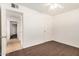 Bedroom features neutral walls and dark hardwood floors at 1266 E Elton Ave, Mesa, AZ 85204