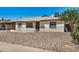 Charming single-story home with a rock landscape, covered parking and a mailbox near the street at 1266 E Elton Ave, Mesa, AZ 85204