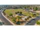 Aerial shot of a community park featuring a playground, gazebo, and open green spaces for recreation at 13587 W Cypress St, Goodyear, AZ 85395