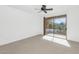 Bright bedroom with a sliding glass door that leads outside, offering natural light and great views at 13587 W Cypress St, Goodyear, AZ 85395
