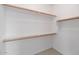 Bright and empty walk-in closet with shelving at 13587 W Cypress St, Goodyear, AZ 85395