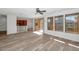 Open-concept living area featuring modern flooring, large windows, and seamless flow into the adjacent kitchen space at 13587 W Cypress St, Goodyear, AZ 85395