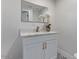 Stylish bathroom with a marble countertop, gold faucet, and patterned floor at 15811 N 60Th Way, Scottsdale, AZ 85254