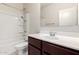 Bright bathroom featuring a combined tub and shower with a vanity and ample counter space at 17263 N Bala Dr, Maricopa, AZ 85138