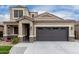 Stunning two-story home showcasing a well-manicured lawn and attractive exterior features at 17263 N Bala Dr, Maricopa, AZ 85138