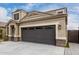 Gorgeous home with a clean driveway, enhanced by beautiful landscaping at 17263 N Bala Dr, Maricopa, AZ 85138