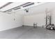 A spacious garage, equipped with ample storage, an automatic door, and a durable concrete floor at 17263 N Bala Dr, Maricopa, AZ 85138