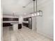 Spacious kitchen featuring a large island, stainless steel appliances, and dark cabinets at 17263 N Bala Dr, Maricopa, AZ 85138