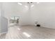 Bright living room with tile floors and access to the outdoor patio at 17263 N Bala Dr, Maricopa, AZ 85138