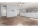 Spacious loft area with neutral carpeting, a ceiling fan, and ample natural light at 17263 N Bala Dr, Maricopa, AZ 85138