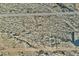 An aerial view of a vacant lot in a developing area with a marked off square by surveyors at 20179 W Highland Ave, Litchfield Park, AZ 85340