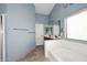 Bright bathroom features a double sink vanity, separate tub and shower with light blue walls at 21047 N Alma Dr, Maricopa, AZ 85138
