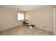 Tiled bedroom with a window for natural light at 21047 N Alma Dr, Maricopa, AZ 85138