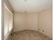 Small bedroom offers neutral walls, tiled floors and natural light at 21047 N Alma Dr, Maricopa, AZ 85138