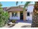Inviting front entrance with desert landscaping and a cozy covered porch at 21047 N Alma Dr, Maricopa, AZ 85138