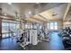 Community gym featuring modern exercise equipment, televisions, and ample natural light at 21047 N Alma Dr, Maricopa, AZ 85138