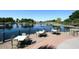 Scenic lake view from a patio with outdoor seating and decorative railings at 21047 N Alma Dr, Maricopa, AZ 85138