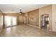 Expansive living room with an open floor plan and access to the backyard at 21047 N Alma Dr, Maricopa, AZ 85138
