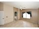 Main bedroom with tile floors, ensuite bathroom and natural light at 21047 N Alma Dr, Maricopa, AZ 85138