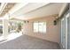 The covered patio has brick pavers and a view of the outdoor area at 21047 N Alma Dr, Maricopa, AZ 85138