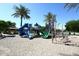 Community playground with colorful slides, climbing structures, and sandy play area at 21047 N Alma Dr, Maricopa, AZ 85138