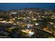 Panoramic shot of a home with a basketball court and pool in a neighborhood with a view of mountains and city lights at 2106 N Bridlewood --, Mesa, AZ 85207