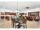 Open-concept dining area adjacent to the kitchen and living room, ideal for hosting dinner parties and Gathering meals at 21960 E Russet Rd, Queen Creek, AZ 85142