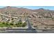 Wide aerial shot showcases a planned community bordering pristine desert landscape and mountain views at 28604 N 21St Ln, Phoenix, AZ 85085