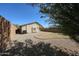 View of backyard featuring gravel, minimal grass and patio area at 28604 N 21St Ln, Phoenix, AZ 85085