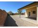 The home has a gravel backyard with a covered patio, perfect for relaxation and outdoor living at 28604 N 21St Ln, Phoenix, AZ 85085