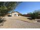 View of backyard featuring gravel, minimal grass and patio area at 28604 N 21St Ln, Phoenix, AZ 85085