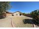 View of backyard featuring gravel, minimal grass and patio area at 28604 N 21St Ln, Phoenix, AZ 85085