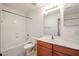 Bathroom featuring a tub and shower combination and a vanity with wooden cabinets at 28604 N 21St Ln, Phoenix, AZ 85085
