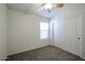 Cozy bedroom with natural light, plush carpet, and a closet with sliding doors at 28604 N 21St Ln, Phoenix, AZ 85085