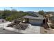 Aerial view of a cozy home, with a two-car garage, desert landscaping, and tile roof at 28604 N 21St Ln, Phoenix, AZ 85085