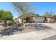 Charming single-story home with a two car garage, xeriscape landscaping, and neutral color palette at 28604 N 21St Ln, Phoenix, AZ 85085