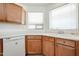 Kitchen has ample counter space, white cabinets, and stainless steel appliances at 28604 N 21St Ln, Phoenix, AZ 85085