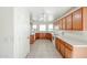 Well-lit kitchen featuring tile floors, and white countertops at 28604 N 21St Ln, Phoenix, AZ 85085